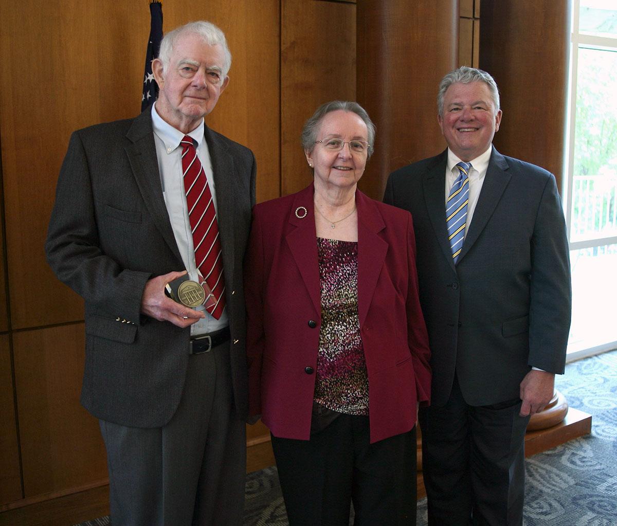 {Bruce and Emily Herrington receive their Quadrangle Society award from LC President Dan McAlexander in 2019.}